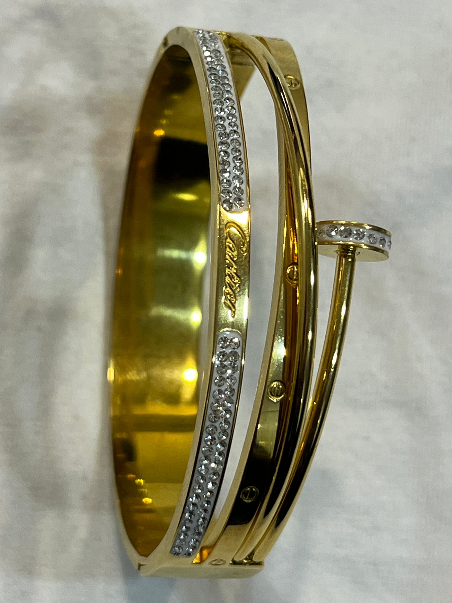 Cartier Elegant Gold Bracelet with Sparkling Stone Accents